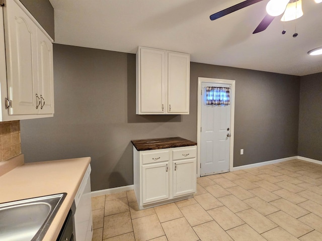 kitchen with ceiling fan, sink, white cabinets, and light tile patterned flooring