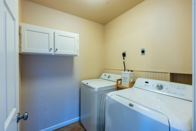 laundry room featuring cabinets and separate washer and dryer