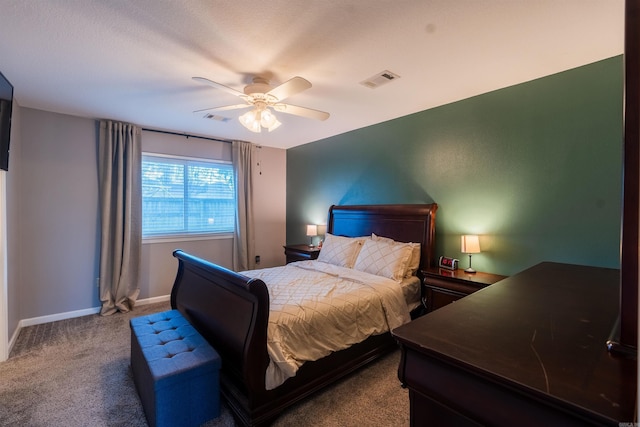 bedroom featuring ceiling fan and carpet