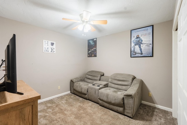 carpeted living room with ceiling fan