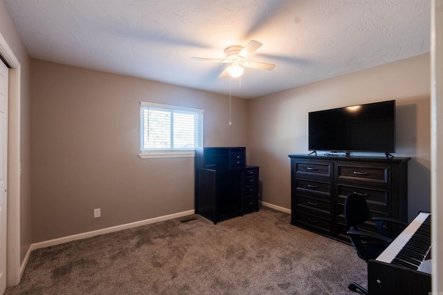 home office with carpet flooring, a textured ceiling, and ceiling fan