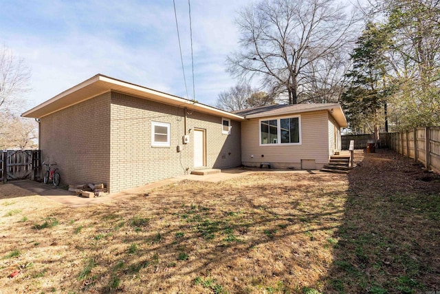 back of property featuring a patio area