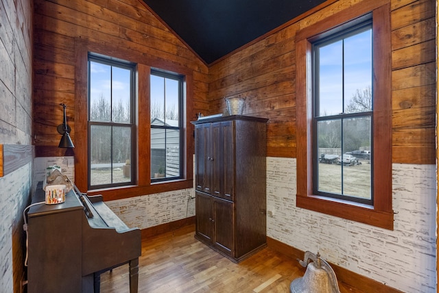 interior space with vaulted ceiling and light wood-type flooring