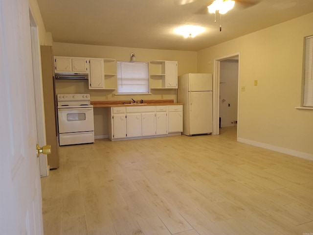 kitchen with sink, white appliances, light hardwood / wood-style flooring, ceiling fan, and white cabinetry