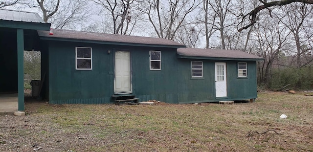 view of outbuilding with a lawn