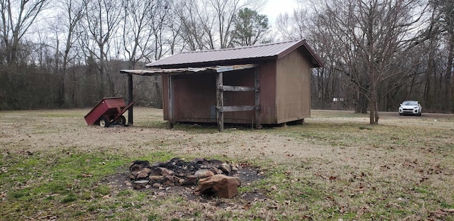 view of outdoor structure featuring a lawn