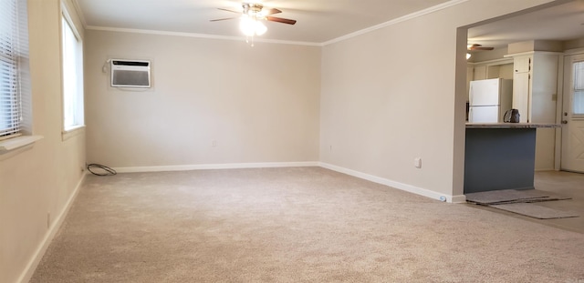 carpeted empty room with crown molding, ceiling fan, and a wall unit AC