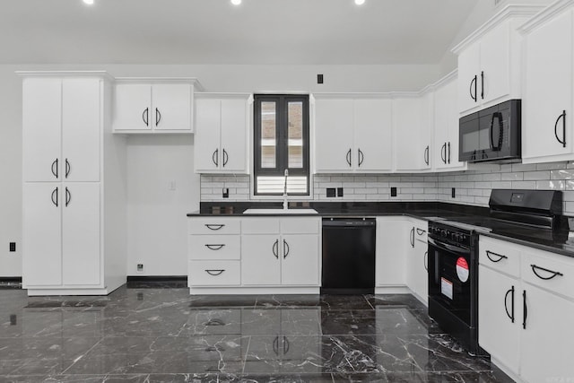 kitchen featuring white cabinetry, black appliances, a sink, dark countertops, and decorative backsplash