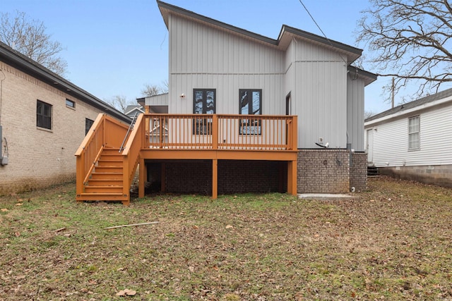 rear view of property featuring a wooden deck