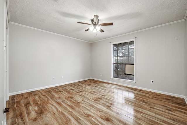 spare room with a textured ceiling, wood-type flooring, ornamental molding, and ceiling fan