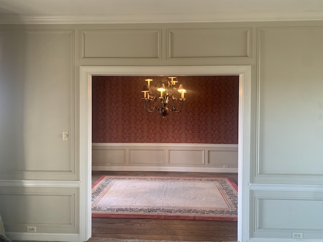 interior space with hardwood / wood-style flooring and a chandelier