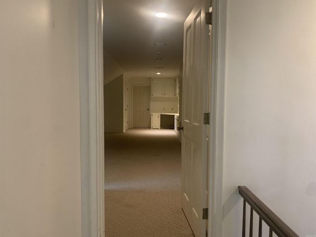 hallway with light carpet