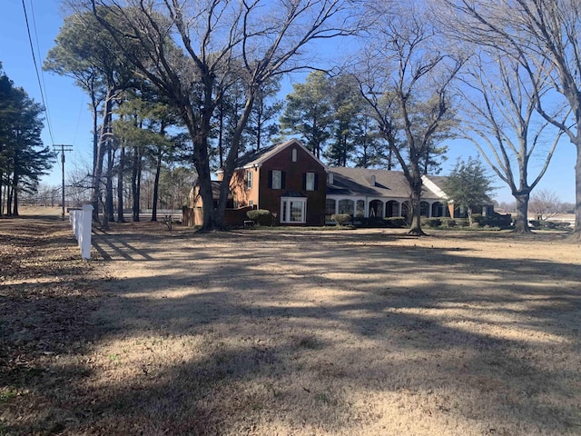 view of side of property featuring a yard