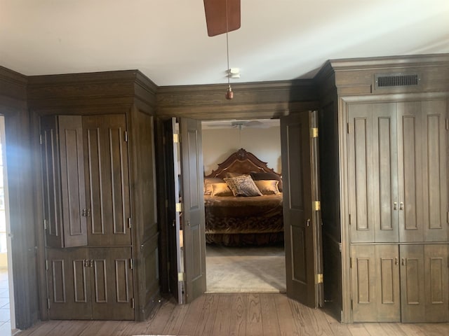 corridor with hardwood / wood-style flooring