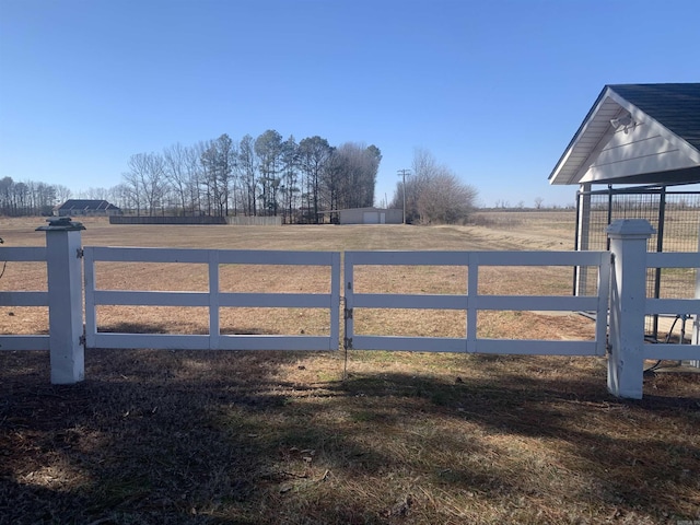 view of gate featuring a rural view