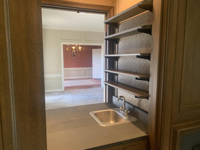 kitchen with sink and an inviting chandelier