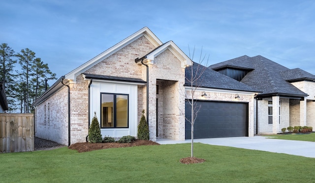 view of front facade with a garage and a front yard