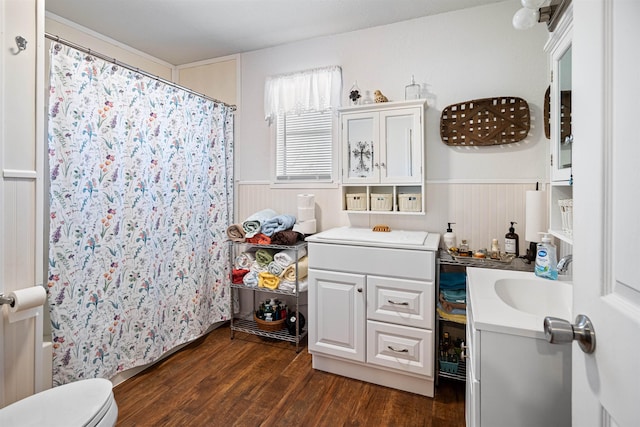 full bathroom with vanity, hardwood / wood-style flooring, toilet, and shower / bath combo with shower curtain