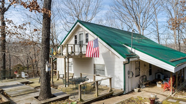 view of property exterior with a balcony