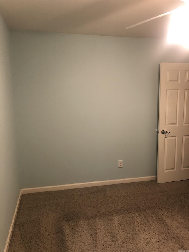 spare room featuring carpet