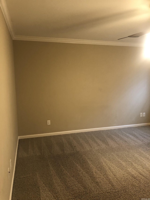 empty room with crown molding, carpet flooring, and ceiling fan