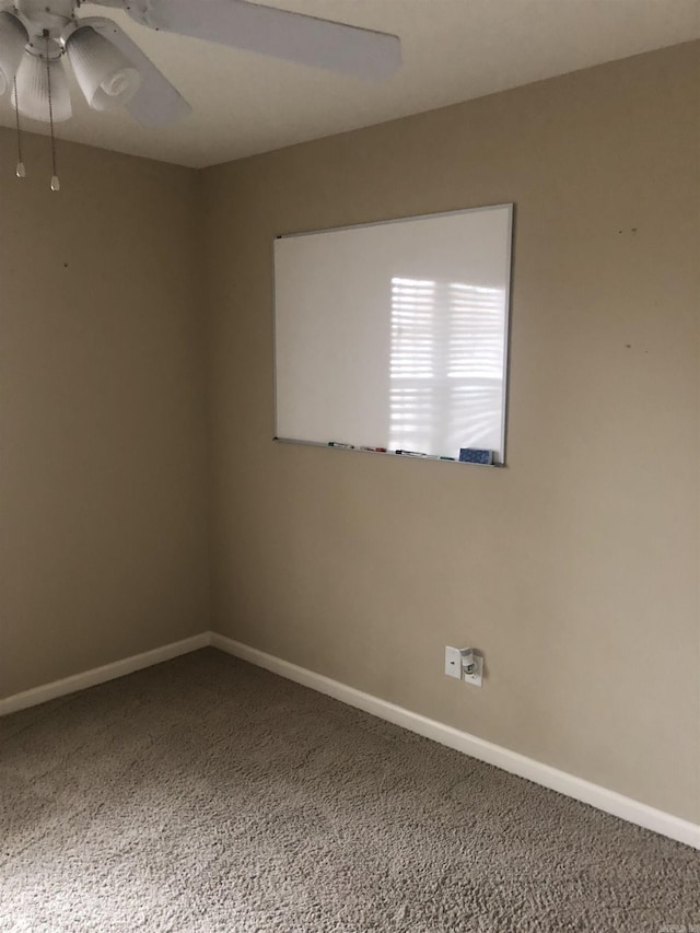 carpeted empty room with ceiling fan