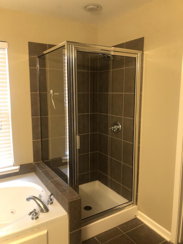 bathroom with tile patterned floors and separate shower and tub