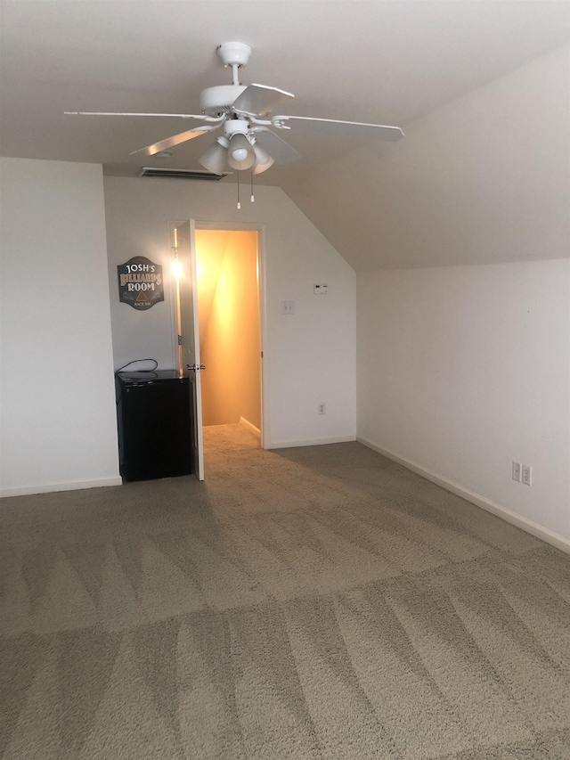 bonus room with lofted ceiling, carpet floors, and ceiling fan