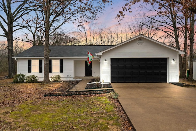 ranch-style home featuring a garage