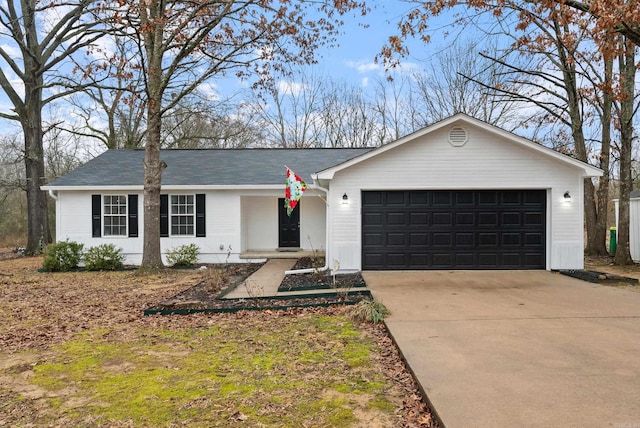 ranch-style home featuring a garage