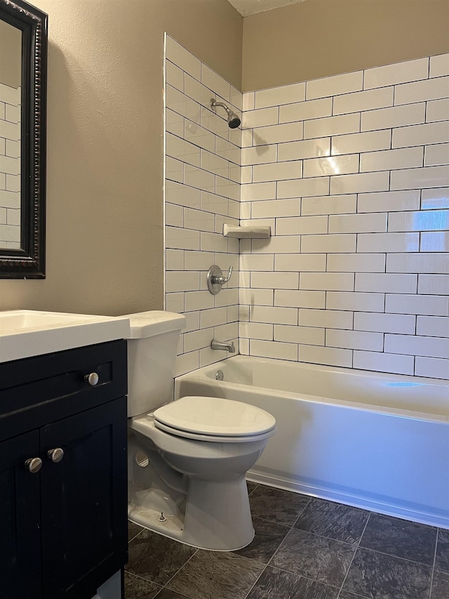 full bathroom with vanity, toilet, and tiled shower / bath combo