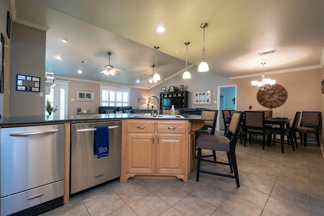 kitchen with crown molding, lofted ceiling, and stainless steel dishwasher