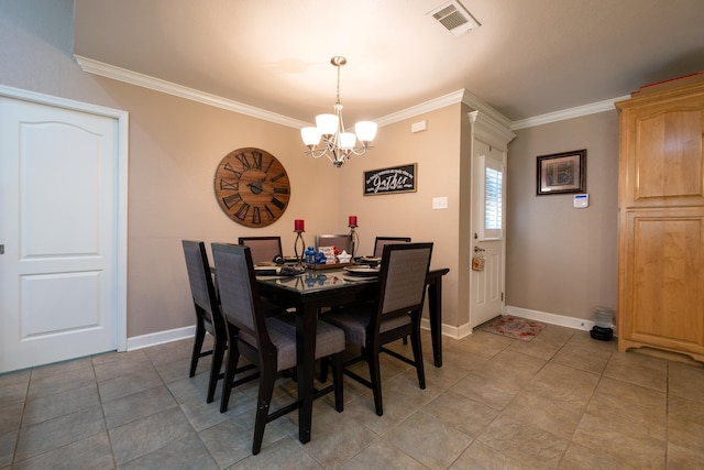 dining area with tile patterned flooring, ornamental molding, and a notable chandelier