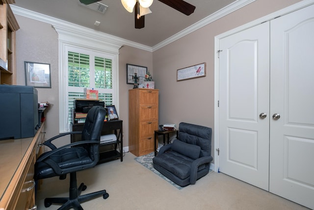 office featuring ceiling fan, ornamental molding, and light carpet