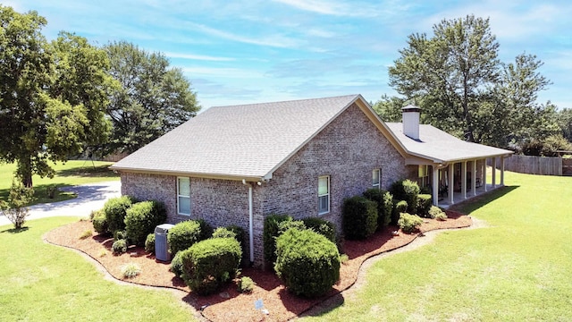 view of property exterior with a yard