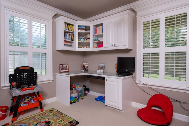 office with built in desk and light carpet