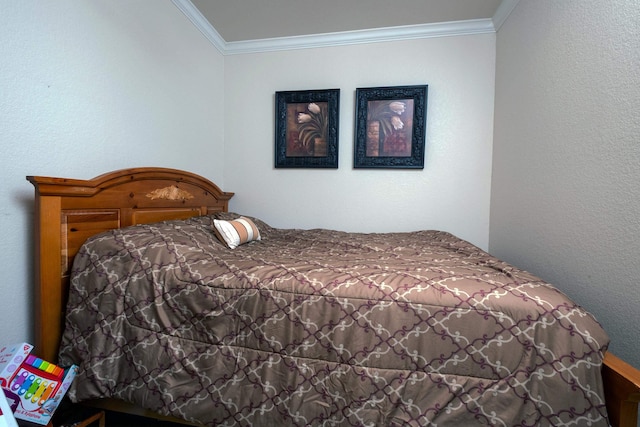 bedroom with crown molding