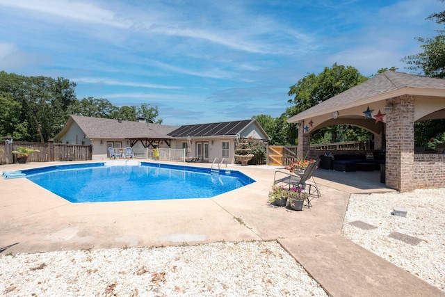 view of swimming pool featuring a patio