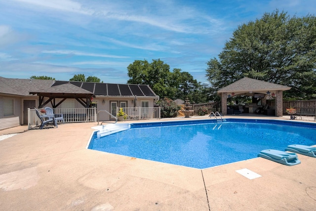 view of swimming pool featuring a gazebo and a patio area