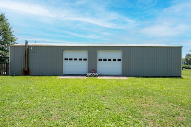 garage featuring a lawn