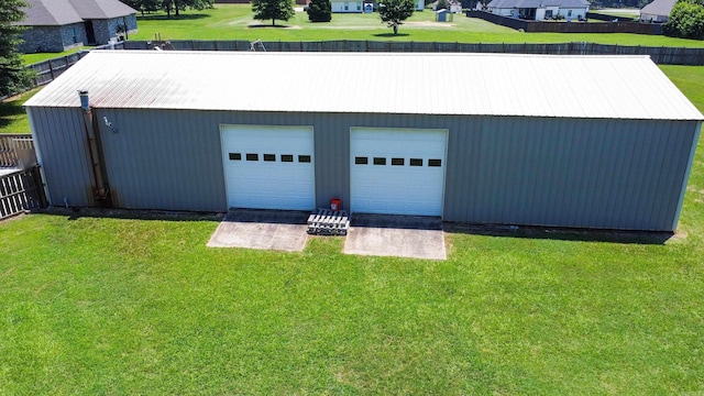 garage featuring a yard