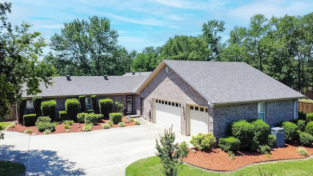 ranch-style house featuring a garage