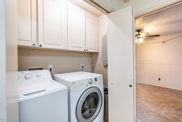 washroom featuring washer and dryer, light colored carpet, cabinets, and ceiling fan