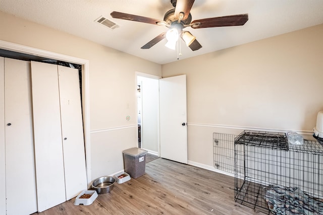 interior space with ceiling fan and light hardwood / wood-style flooring