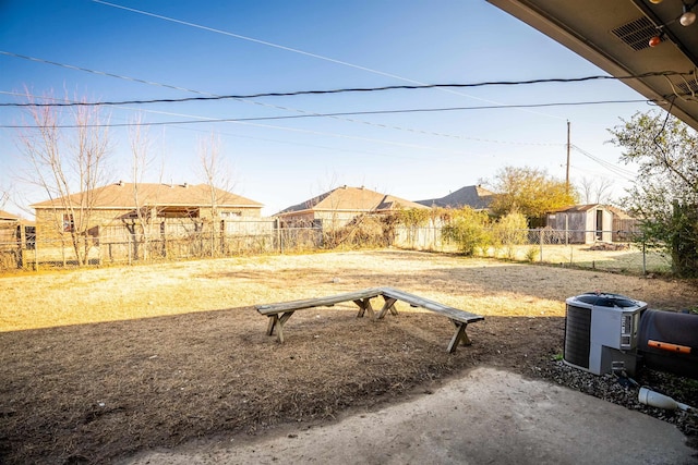 view of yard with central air condition unit