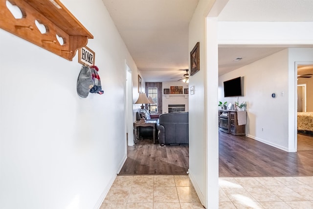 hallway with light tile patterned flooring