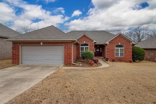 ranch-style house with a garage and a front lawn