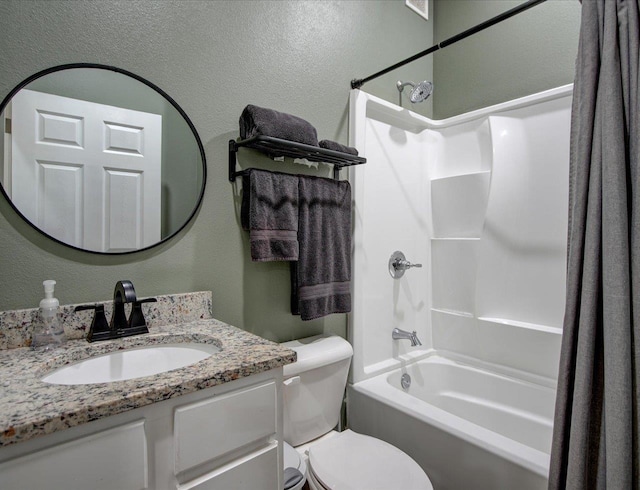 full bathroom with vanity, shower / tub combination, and toilet