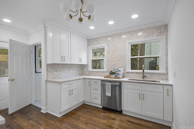 kitchen featuring sink, dark hardwood / wood-style floors, ornamental molding, white cabinets, and stainless steel dishwasher