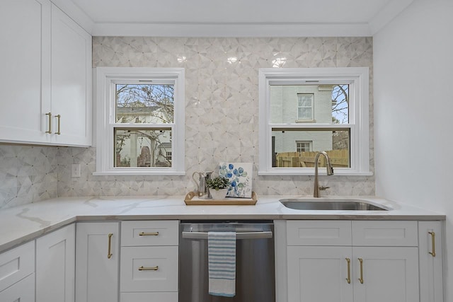 kitchen with dishwasher, light stone countertops, sink, and white cabinets